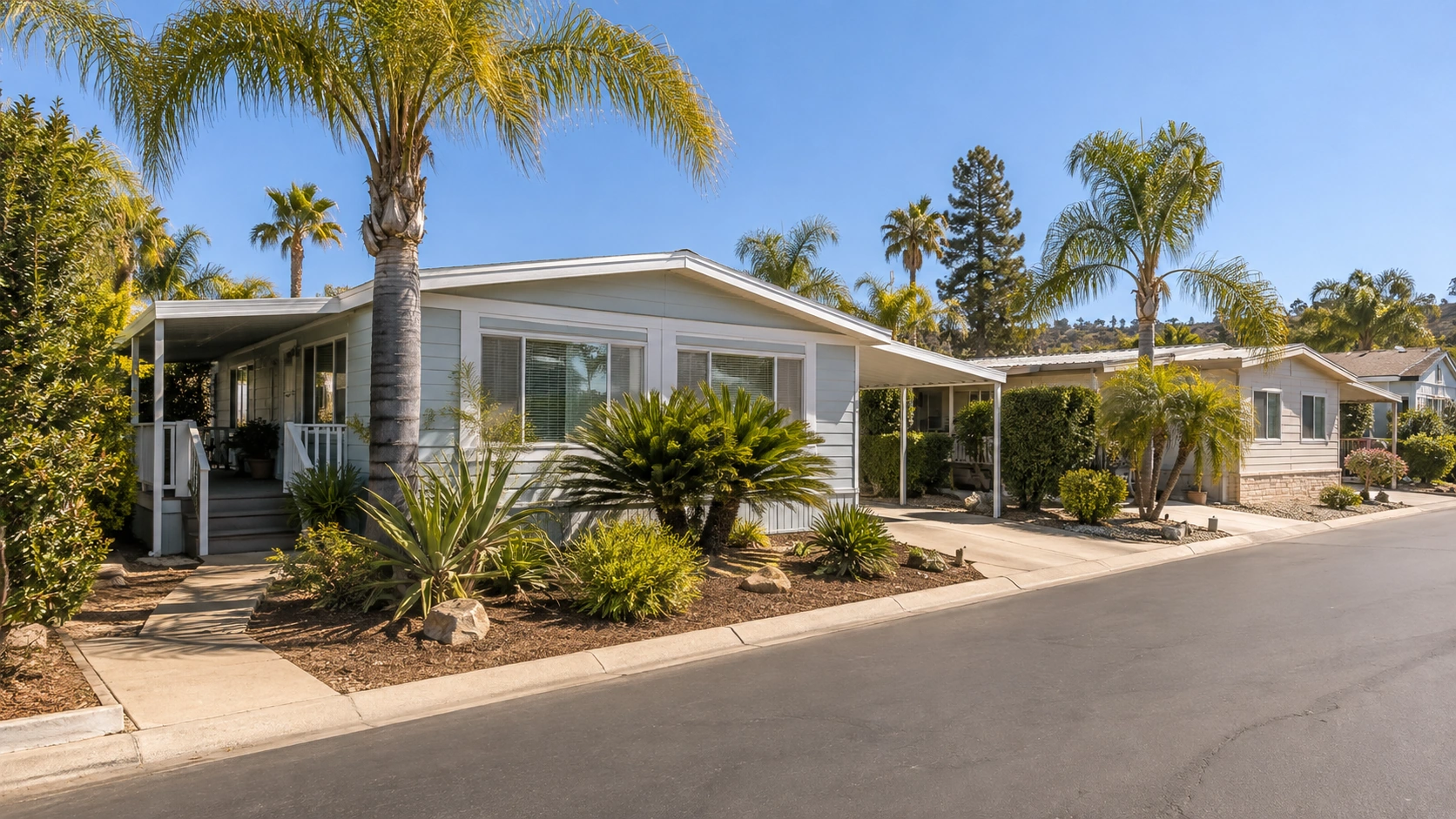 Well-maintained manufactured home with tidy landscaping in a Southern California community