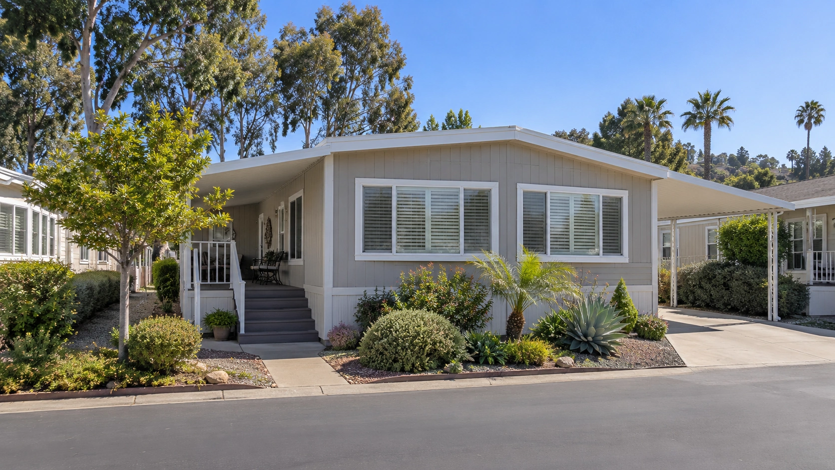 Well-maintained manufactured home with tidy landscaping in a Southern California community.
