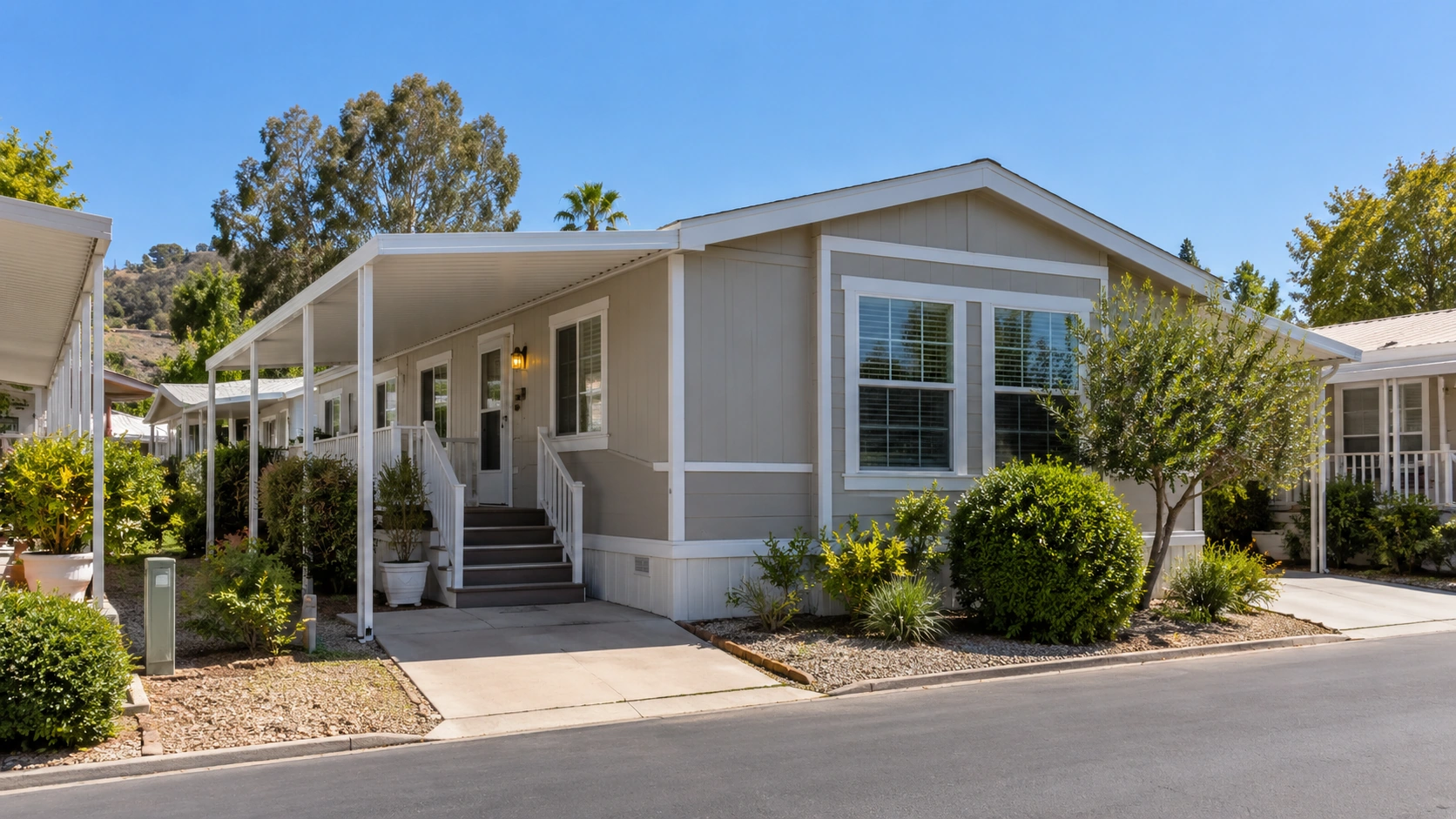 Well-maintained manufactured home with landscaped front yard in a Southern California mobile home community